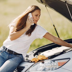 woman near broken car call help