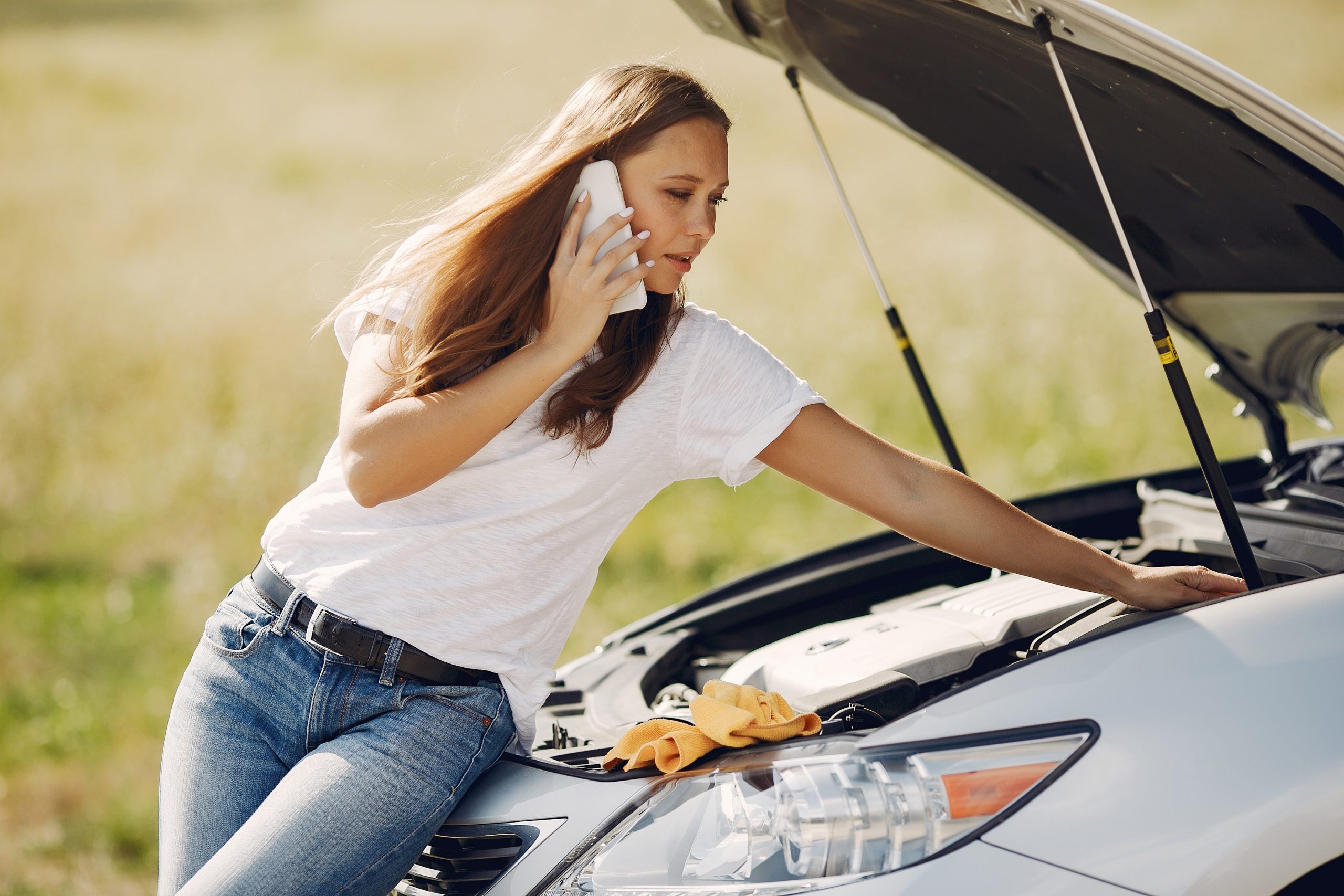 woman near broken car call help